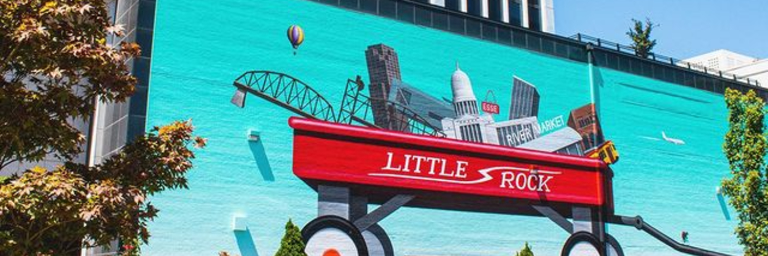 Photo of the "Playtime" mural on Main Street in Downtown Litlte Rock. It's one of the best photo spots in town!